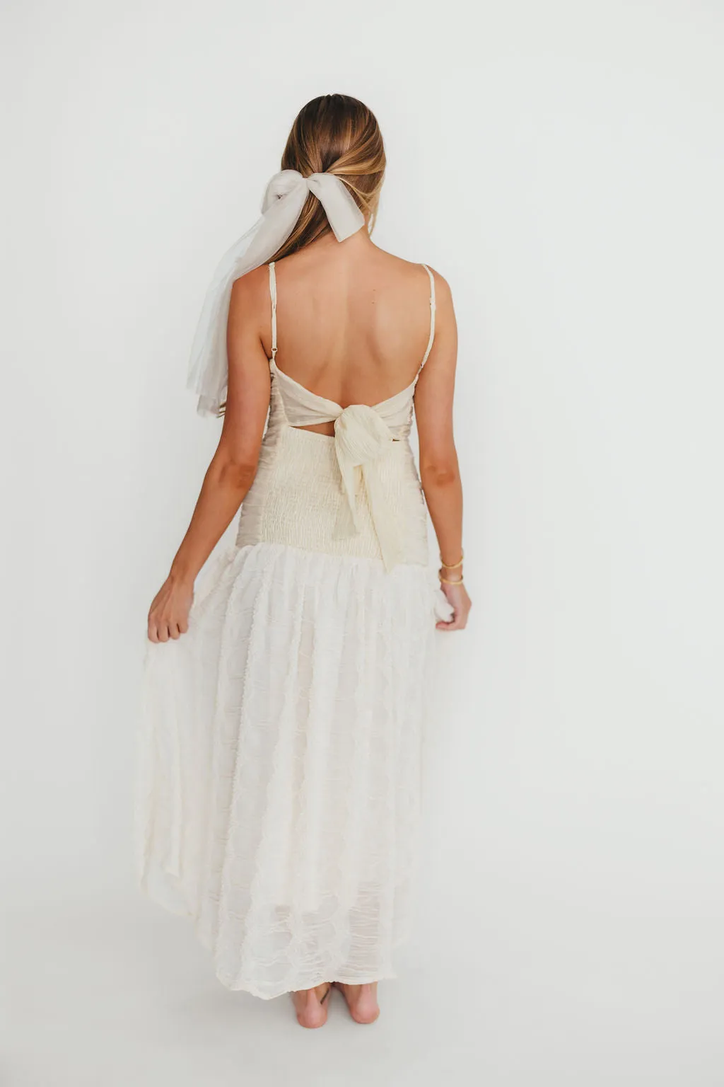 Rosie Ruched Maxi Dress With Bow Back Detail in Cream